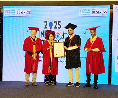 Dr. Sabyasachi Saha on stage with other honorees in academic robes at India Conclave 2025, Chennai