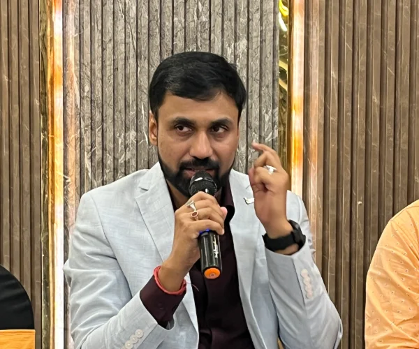 Dr. Sabyasachi Saha answering a question with a microphone at the EUPHORIA GenX Corporate Conclave 2026