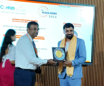 Dr. Sabyasachi Saha receiving a memento at ICAILIHMI 2025, NSHM Global Conference, Durgapur