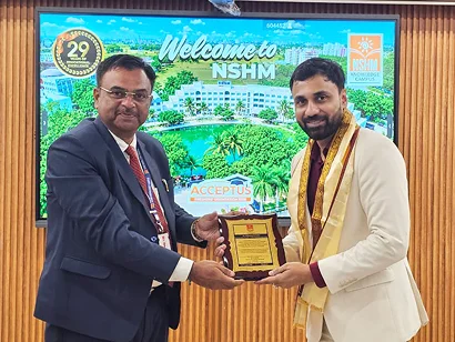 Dr. Sabyasachi Saha receiving a memento at the NSHM Inauguration 2026