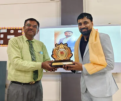 Dr. Sabyasachi Saha receiving a memento at NSHM Knowledge Campus, Durgapur