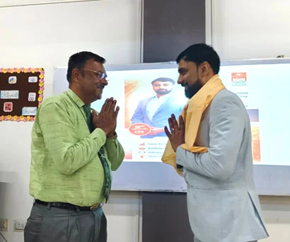Dr. Sabyasachi Saha exchanging greetings with a faculty member at NSHM Knowledge Campus, Durgapur