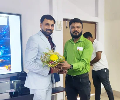 Dr. Sabyasachi Saha receiving a bouquet at Sanaka Education Trust's Group of Institutions, Durgapur