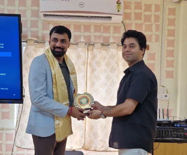 Dr. Sabyasachi Saha receiving a memento at Swami Vivekananda University after his session 'Take on Techies'