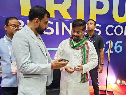 Dr. Sabyasachi Saha in conversation with a delegate at the Tripura Business Conclave 2026